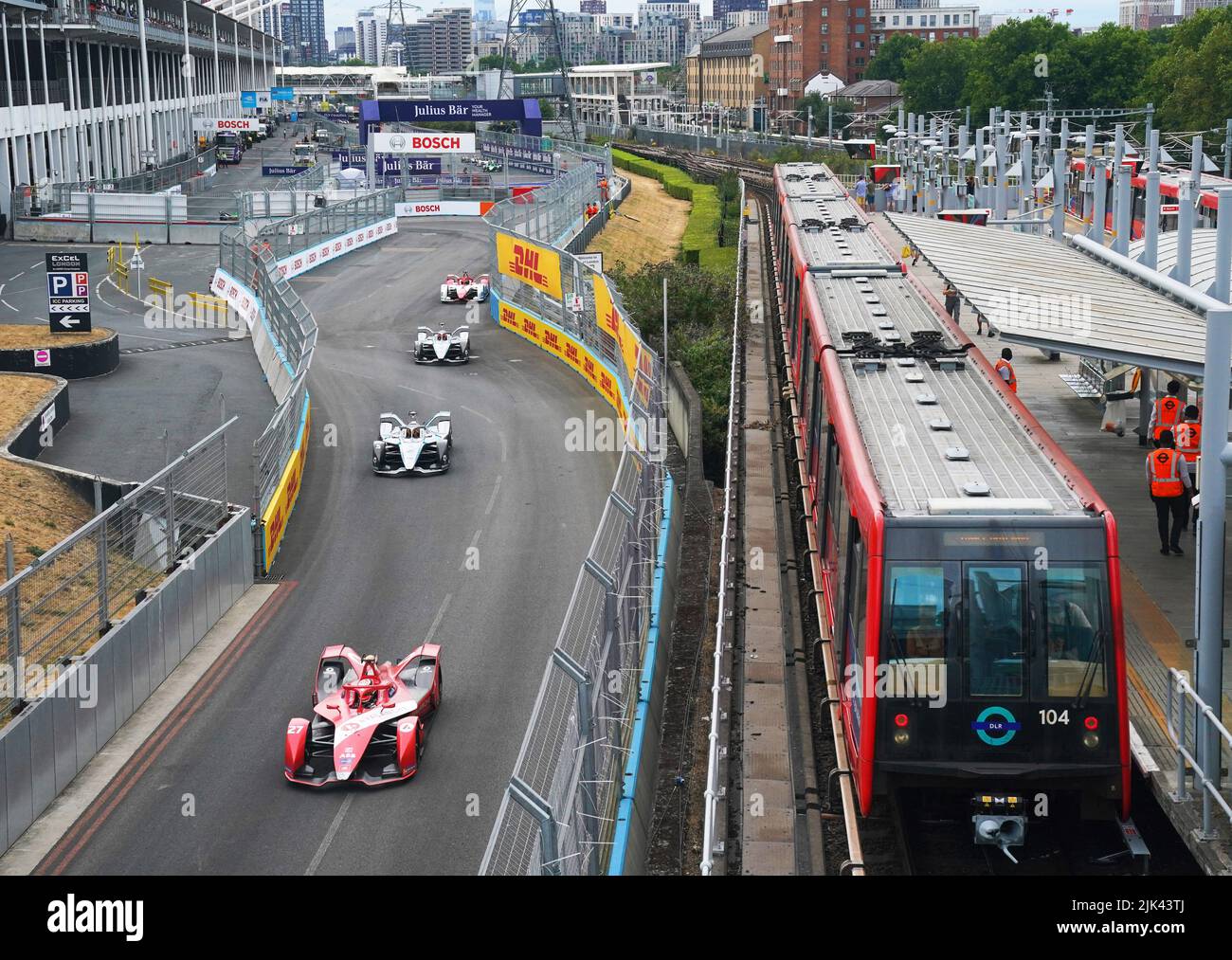 Jake Dennis leads on approach to turn thirteen as the field pass the London Docklands Light Railway line at Prince Regent Station during the 2022 SABIC London E-Prix at the ExCel Circuit, London. Picture date: Saturday July 30, 2022. Stock Photo