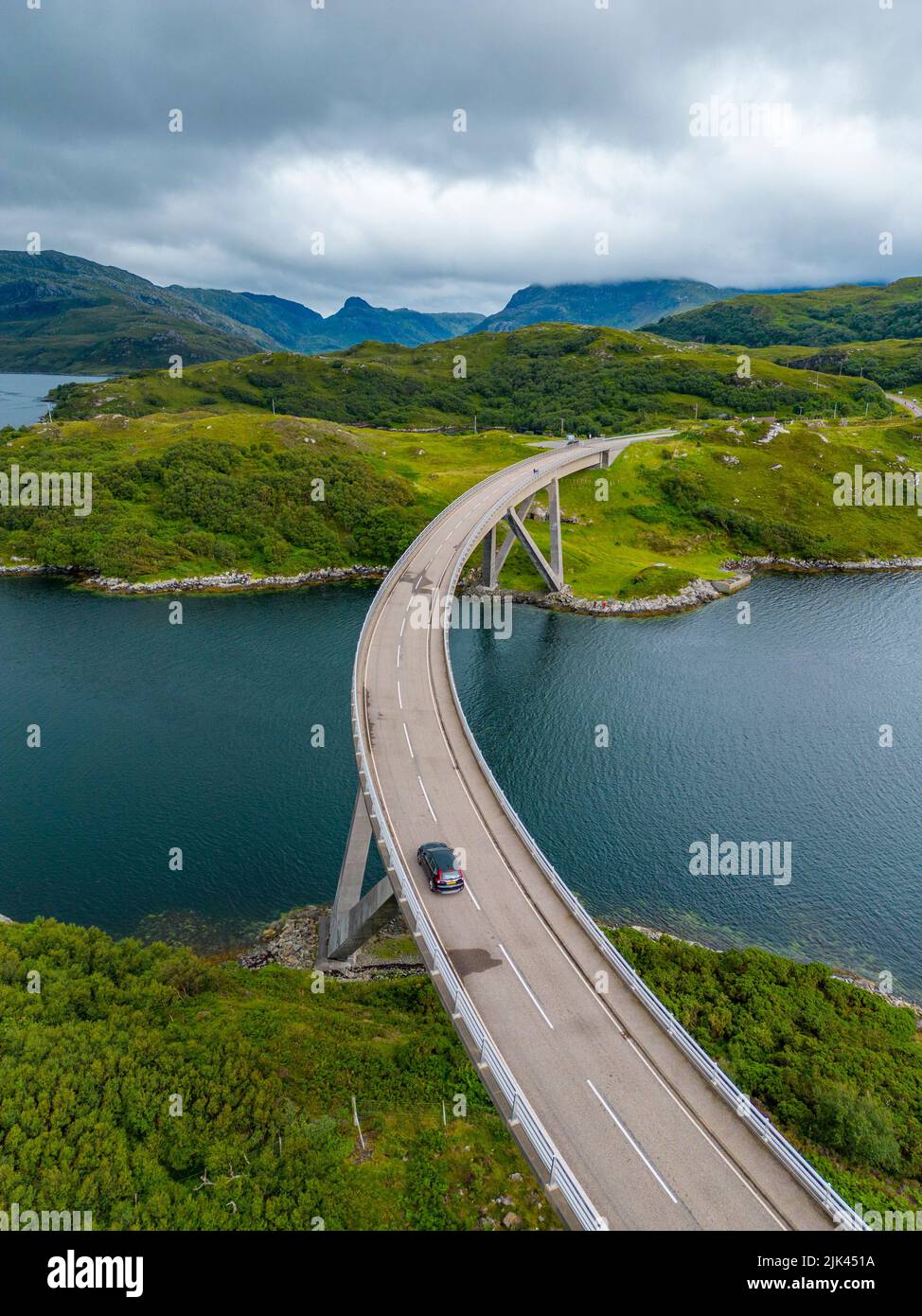 Aerial view of Kylesku Bridge crossing Loch a Chàirn Bhàin on North Coast 500 tourist route, Sutherland, Scotland Stock Photo
