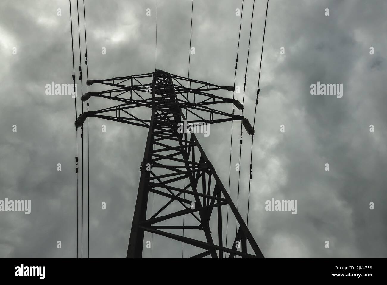 Power line pylon against the background of the dark cloudy sky Stock ...