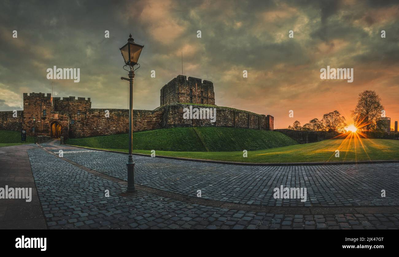 Carlisle Castle view with lamp post at sunrise with De Ireby's Tower and The Keep behind. Stock Photo
