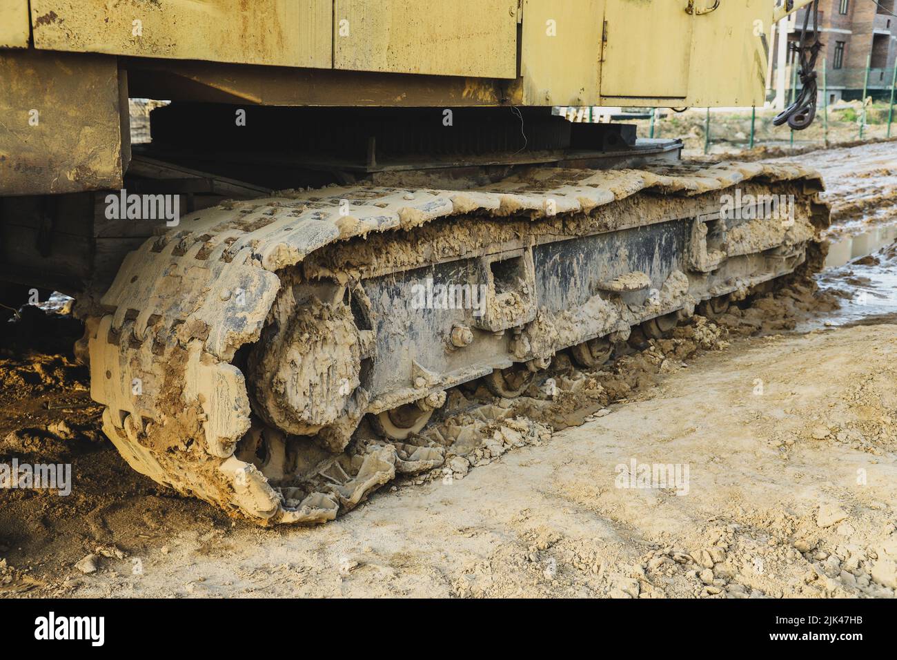 Detail of dirty caterpillar track in construction site Stock Photo