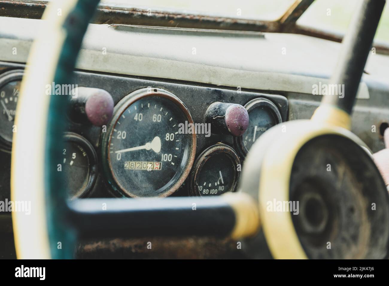 The dashboard in an old car close-up. Speedometer and gauges Stock Photo
