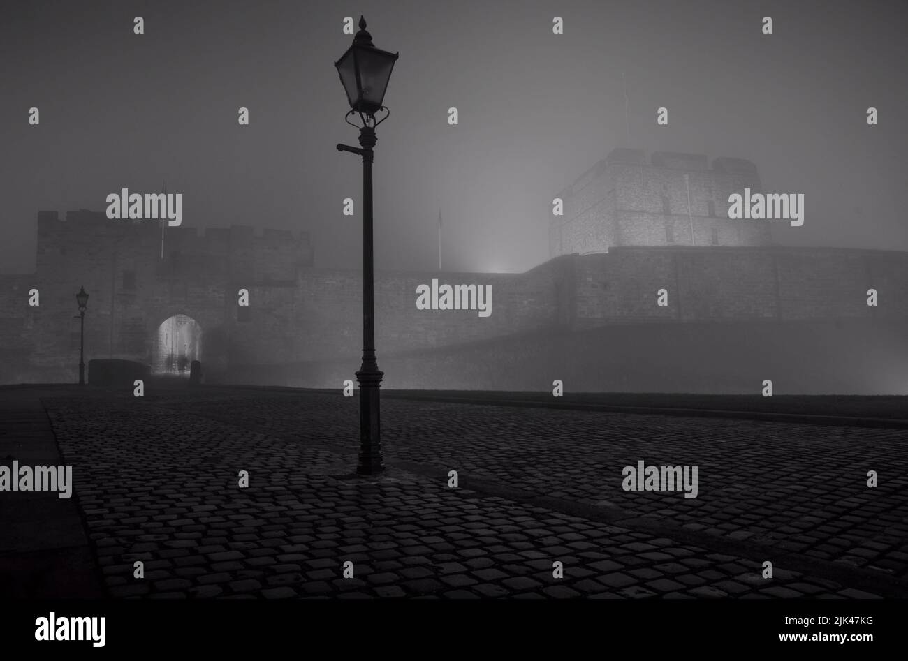Carlisle Castle captured on a foggy evening in Cumbria. Stock Photo