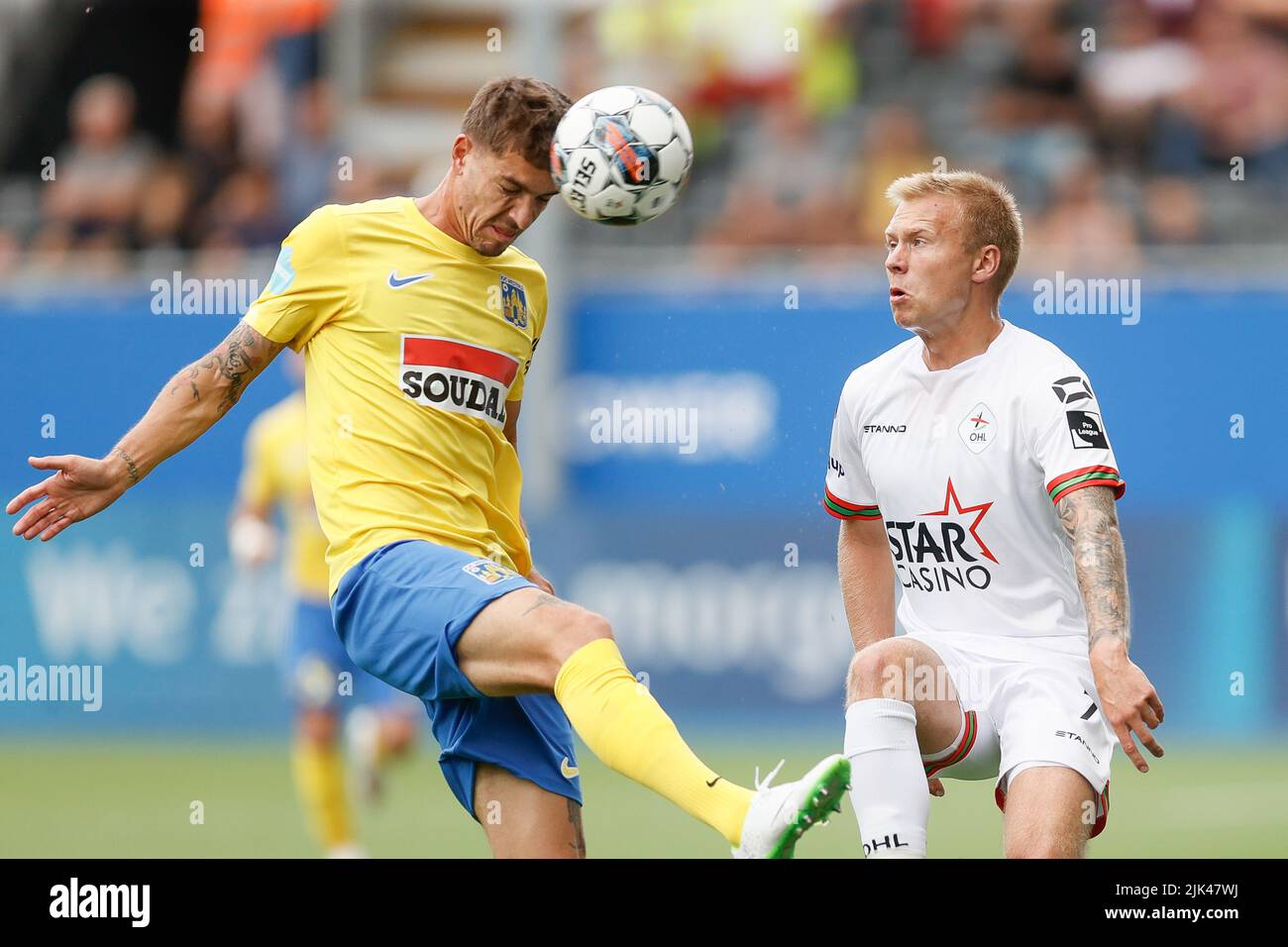 Westerlo's Roman Neustadter and OHL's Jon Thorsteinsson fight for the
