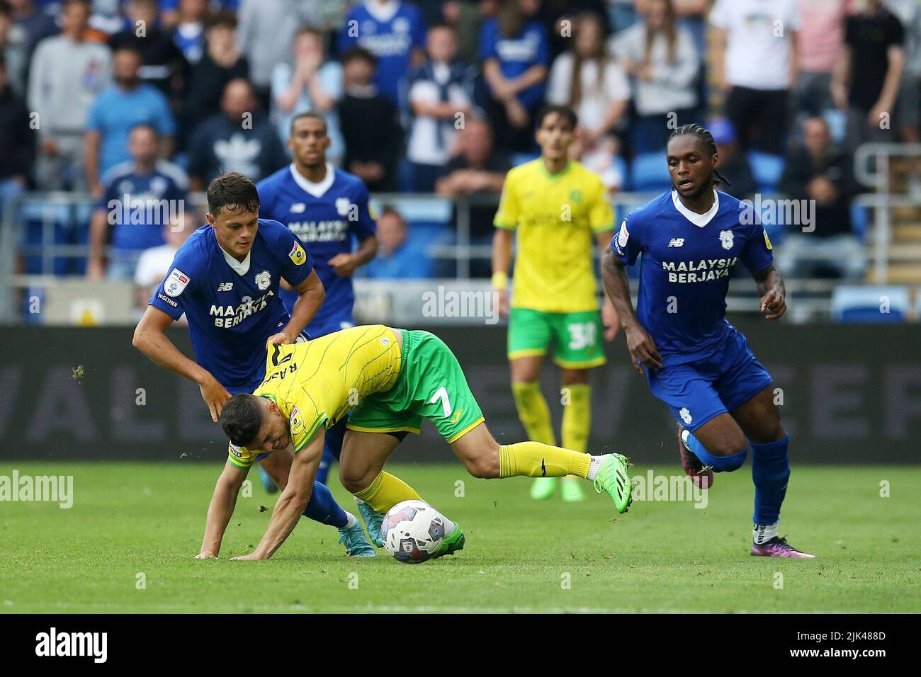 Perry NG of Cardiff city (l) fouls Milot Rashica of Norwich city and is shown 2nd yellow card, plus red card and sent off for the tackle. EFL Skybet championship match, Cardiff city v Norwich City at the Cardiff City Stadium in Cardiff, Wales on Saturday 30th July 2022. this image may only be used for Editorial purposes. Editorial use only, license required for commercial use. No use in betting, games or a single club/league/player publications. pic by Andrew Orchard/Andrew Orchard sports photography/Alamy Live news Stock Photo
