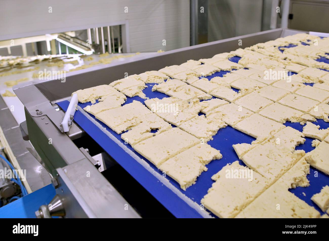 Dough cutting line for biscuits. The latest biscuit production line. Large biscuit factory Stock Photo