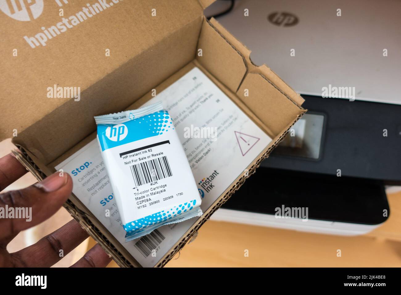 HP ink delivered in cardboard package as part of subscription printing Stock Photo