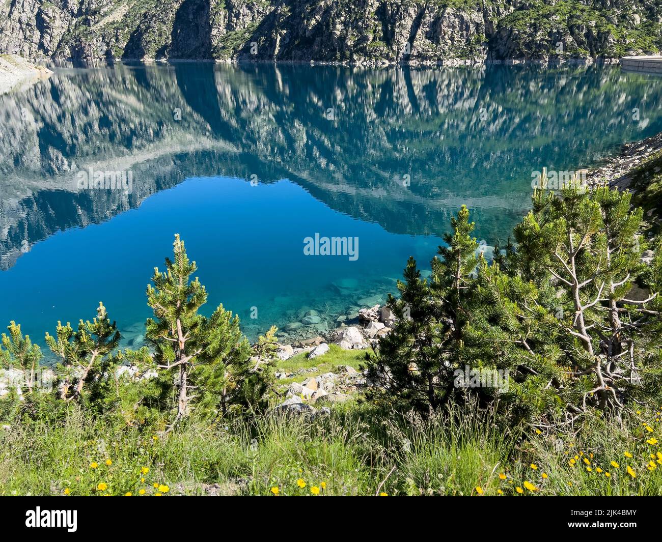 Lac de Cap-de-Long reservoir high amongst Pyrenees mountains in France Stock Photo
