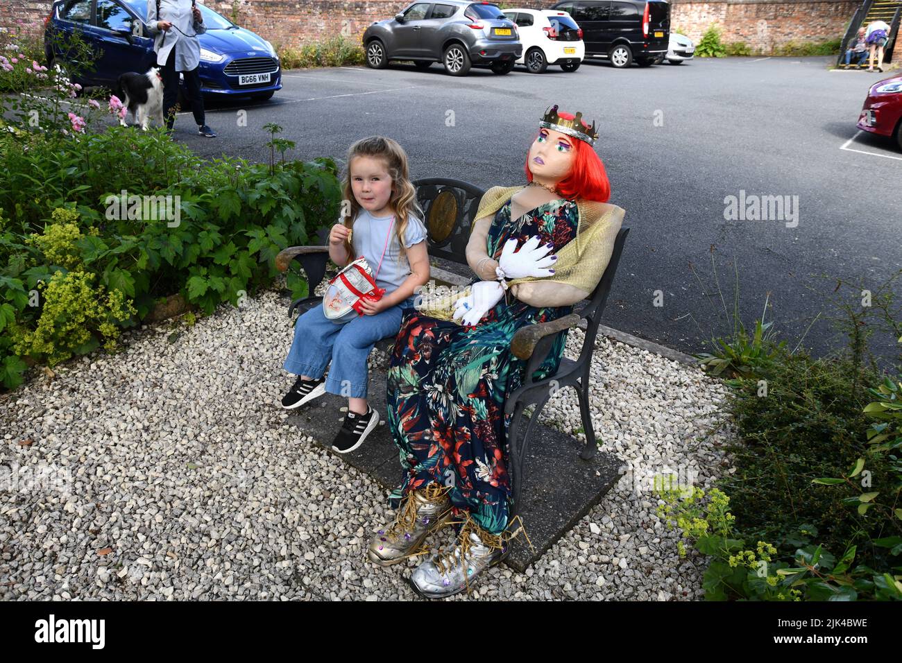 Young child and scarecrow princess at Coalbrookdale scarecrow festival Stock Photo