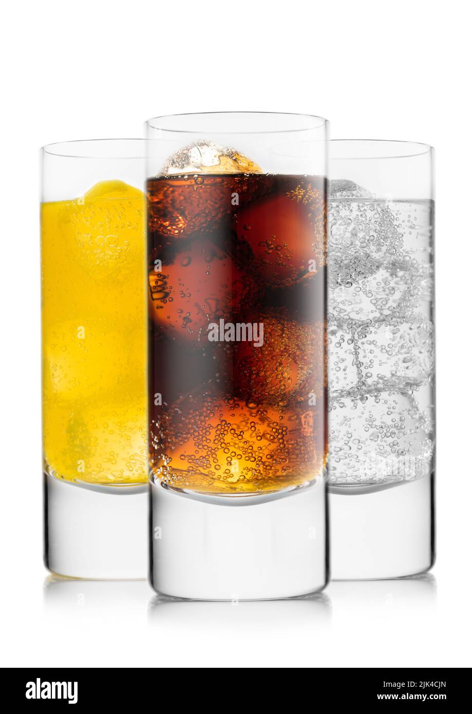 Cola soft drink with orange soda and lemonade with ice cubes on white