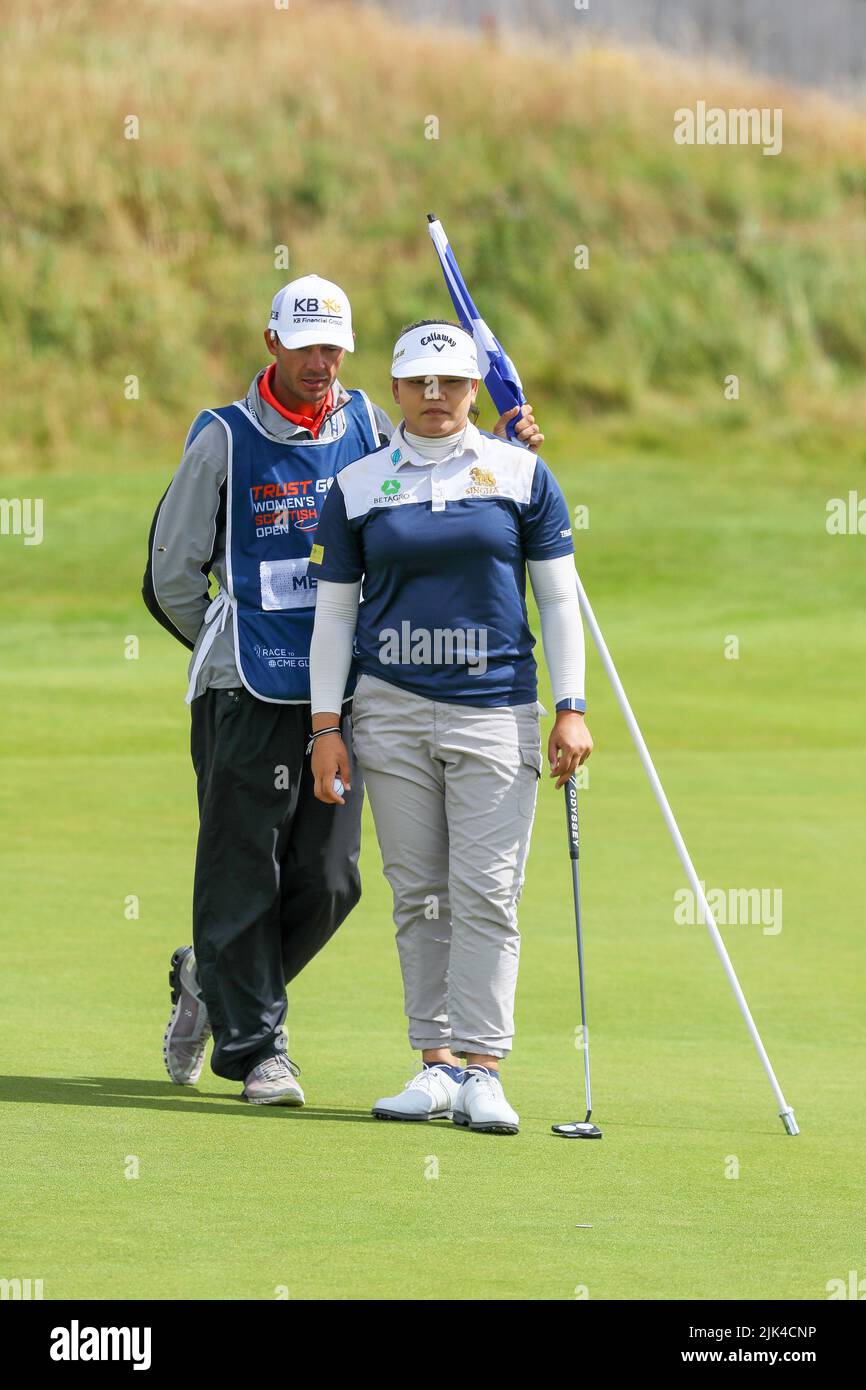 Irvine, UK. 30th July, 2022. The third round of the Trust Golf Women's Scottish Golf took place with 75 players making the cut. Heavy overnight rain from Friday into Saturday made for a softer and more testing course. Wichanee Meechai and her caddie consider the putt on the 10th green. Credit: Findlay/Alamy Live News Stock Photo