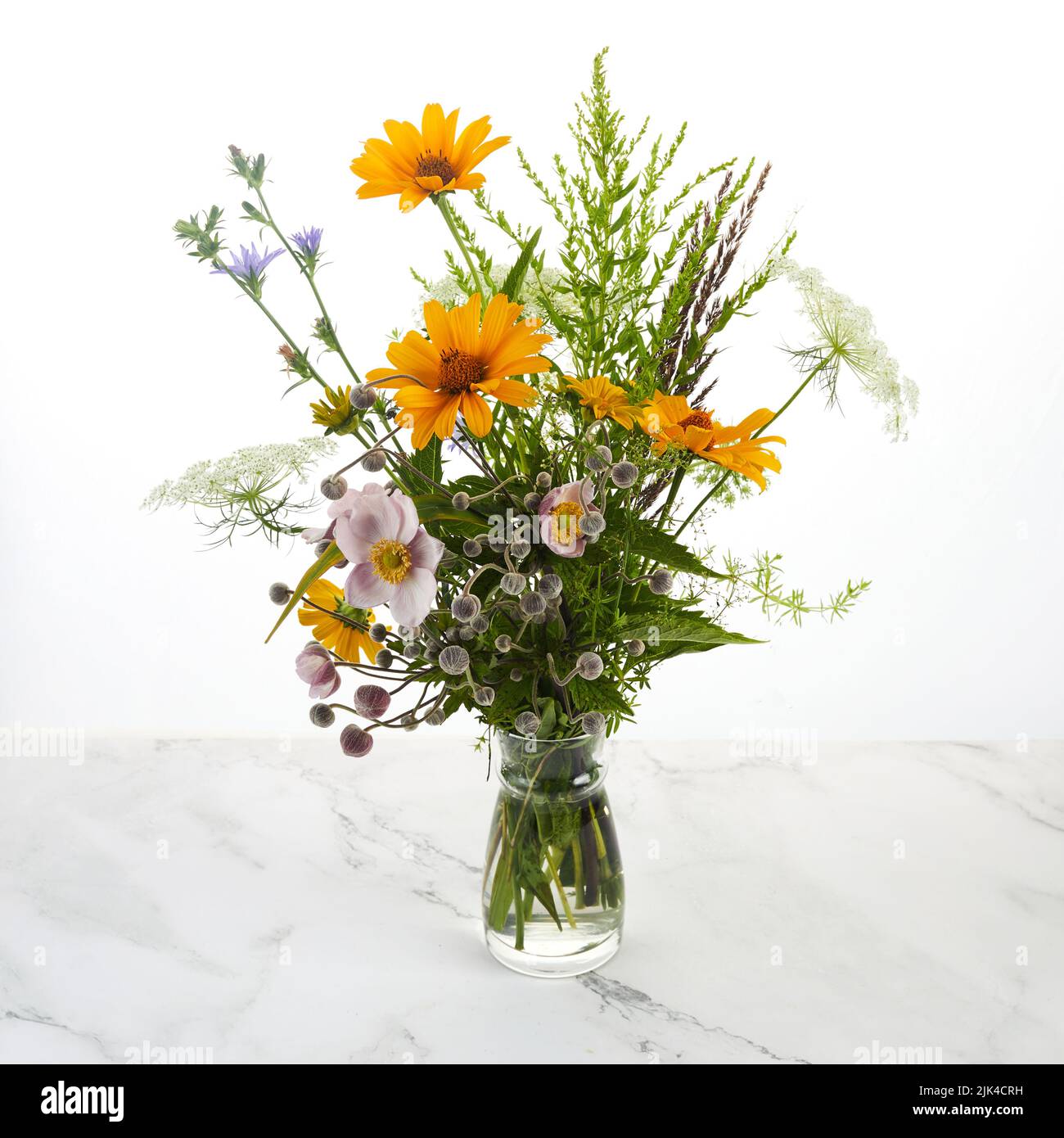 Beautiful bouquet of wildflowers on white. Stock Photo