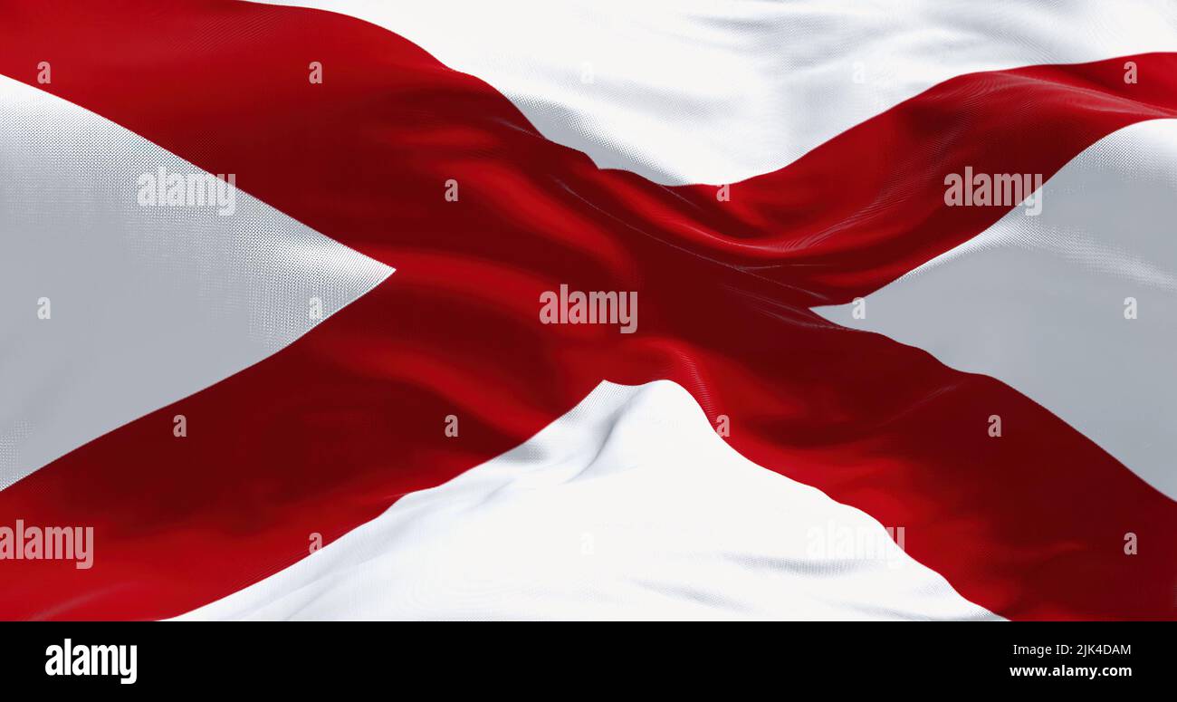 Close up of the Alabama state flag waving in the wind. Alabama is a state in the Southeastern region of the United States. Democracy and independence. Stock Photo