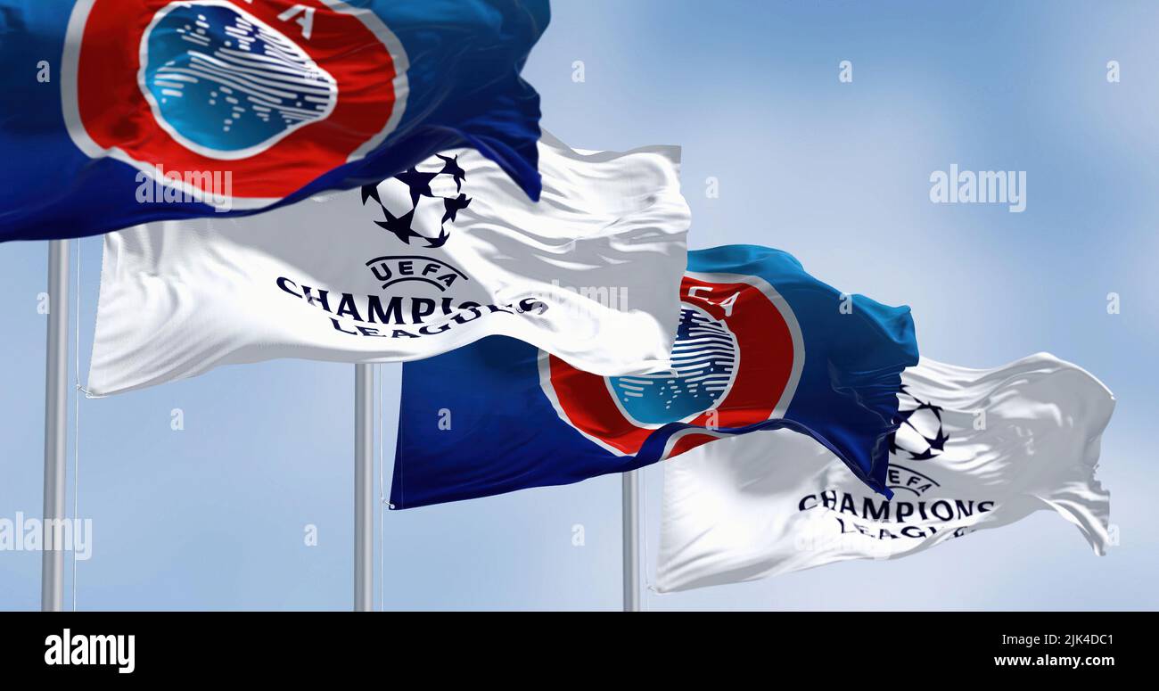 Istanbul TUR, July 2022: Flags with UEFA and UEFA Champions League waving in the wind. Champion League is the most prestigious club competition in Eur Stock Photo