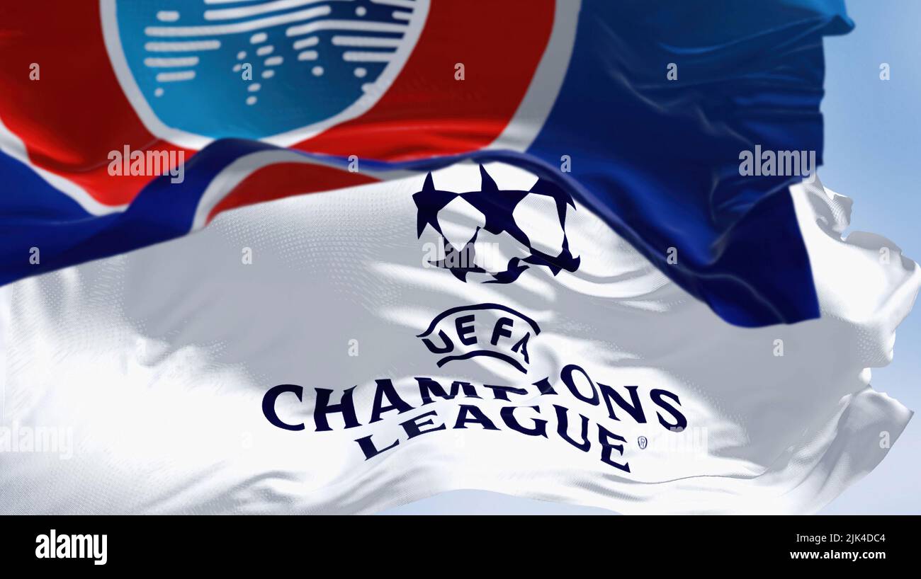 Istanbul TUR, July 2022: Flags with UEFA and UEFA Champions League waving in the wind. Champion League is the most prestigious club competition in Eur Stock Photo