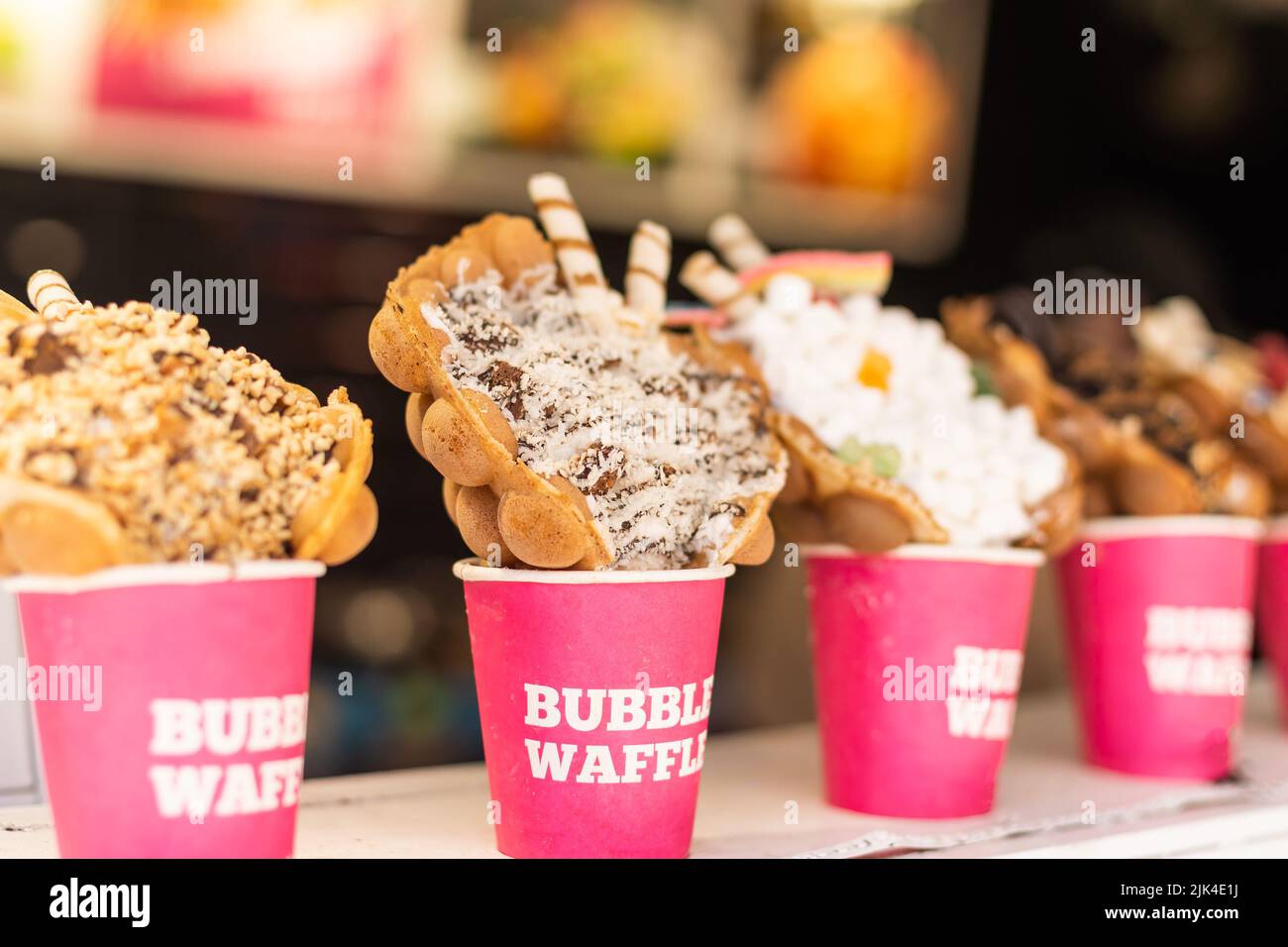 Different types of bubble waffle ice cream to go Stock Photo Alamy