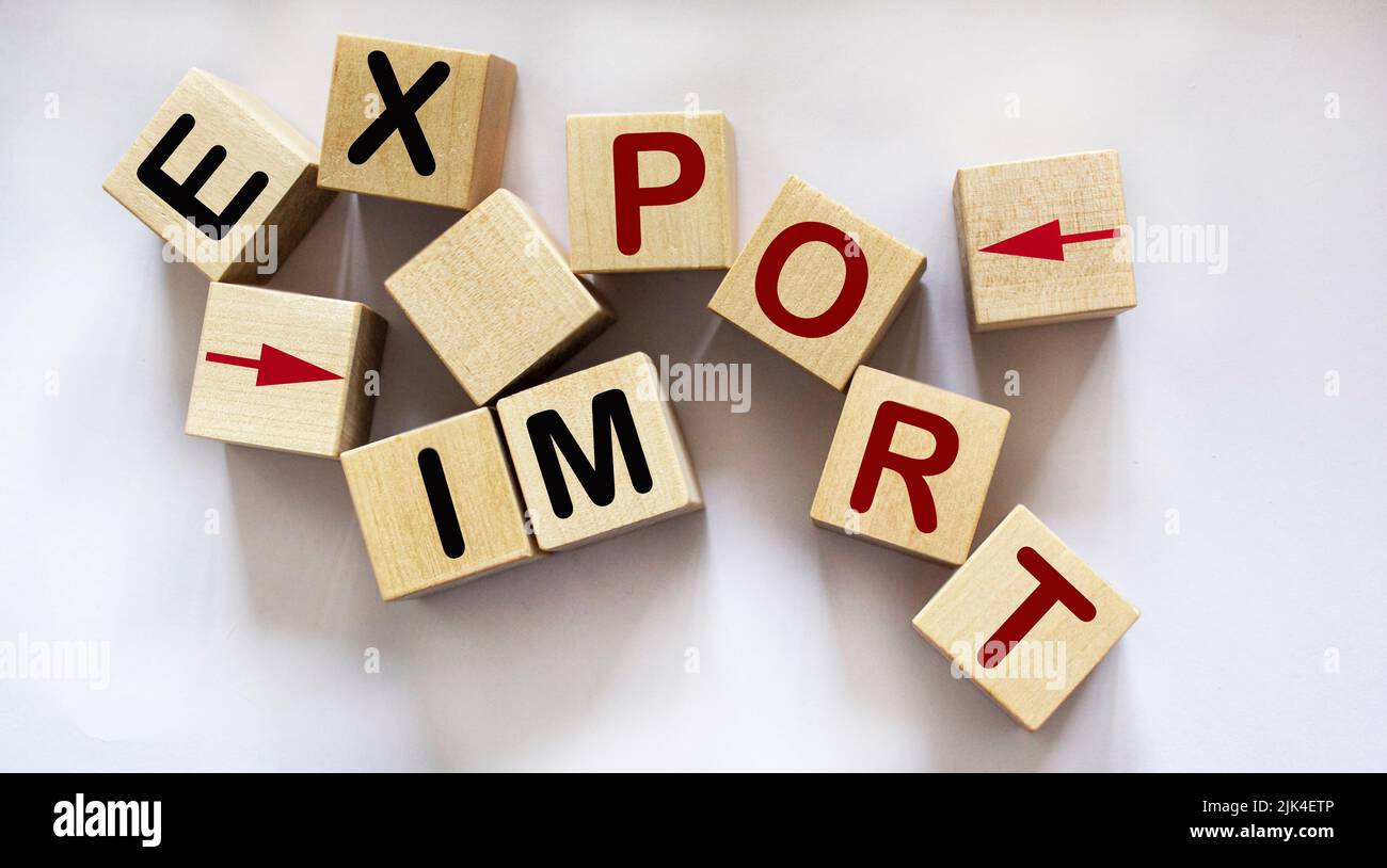 text Import, export and pointers written on wooden blocks and white background Stock Photo