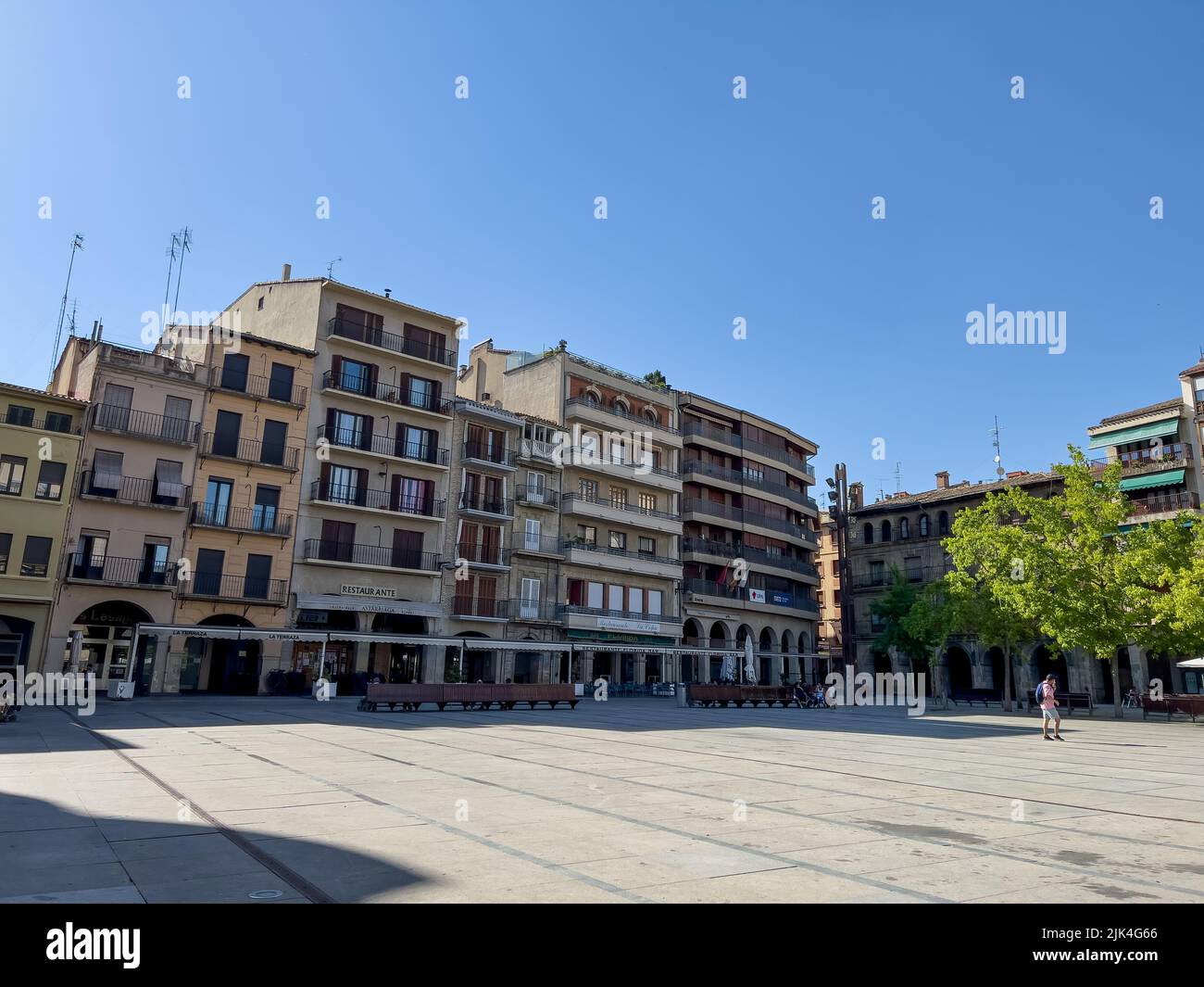 a town square with cafes. restaurants and pavement seating Stock Photo