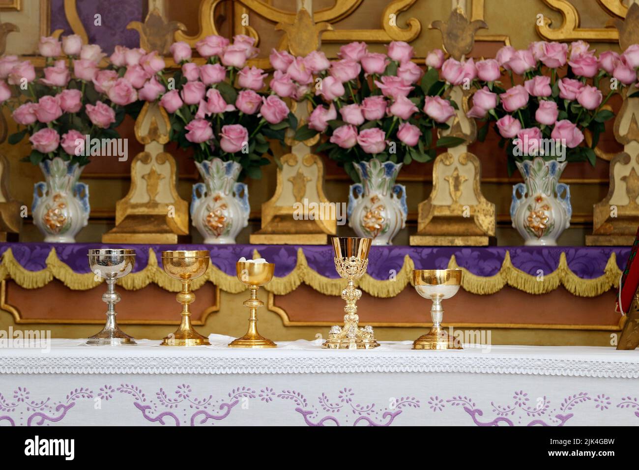 chalice and ambula on the altar, moment of the holy mass - Consecration of bread and wine in the body and blood of Jesus - Sacred Host, liturgical obj Stock Photo