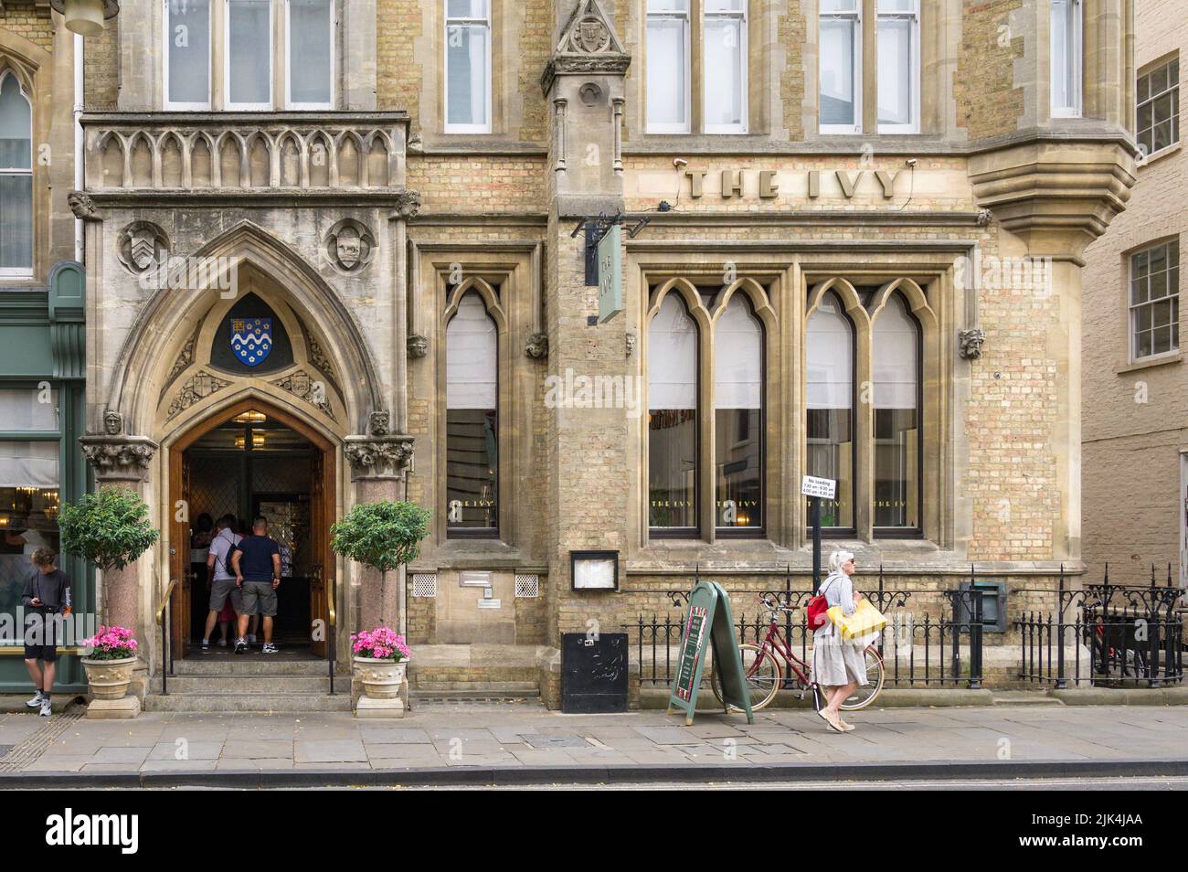 Exterior of The Ivy Brasserie restaurant with people walking past, Oxford, UK Stock Photo
