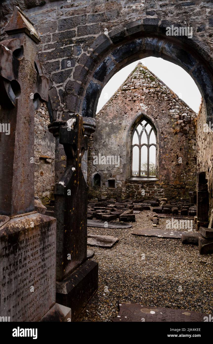 Gothic pointed arch window and tracery, Burrishoole Friary ruins in County Mayo, Ireland. Stock Photo