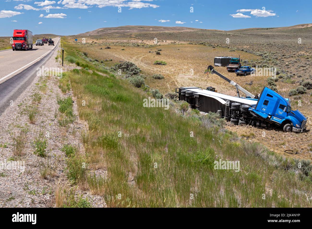 Diamondville, Wyoming - A semi-trailer truck that drove off U.S. Highway 30 and overturned in southwestern Wyoming. Stock Photo