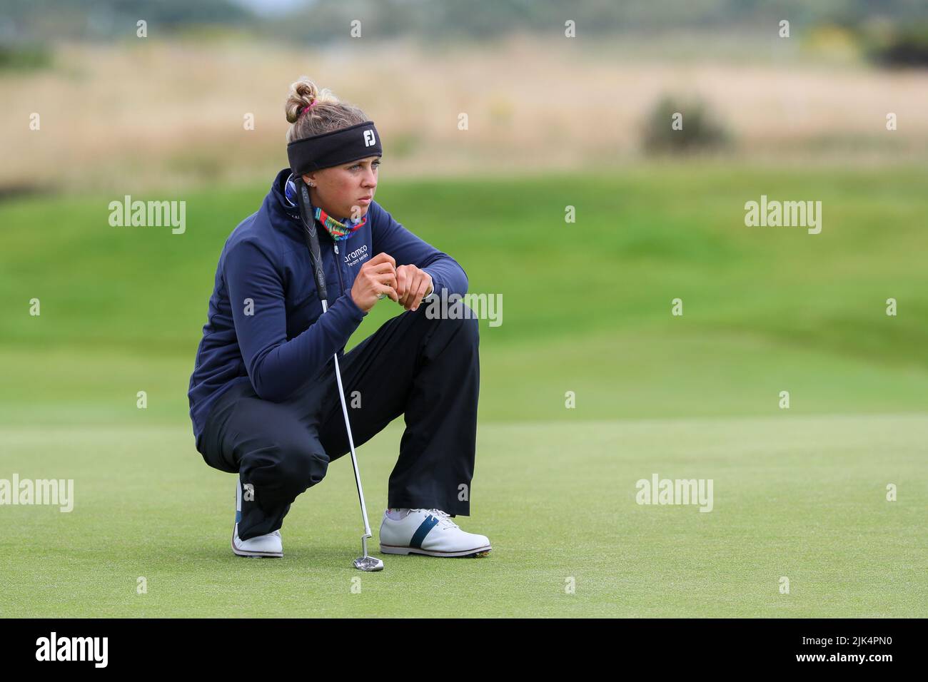 Irvine, UK. 30th July, 2022. The third round of the Trust Golf Women's Scottish Golf took place with 75 players making the cut. Heavy overnight rain from Friday into Saturday made for a softer and more testing course. Pauline Rousin waiting to putt on the 5th green. Credit: Findlay/Alamy Live News Stock Photo