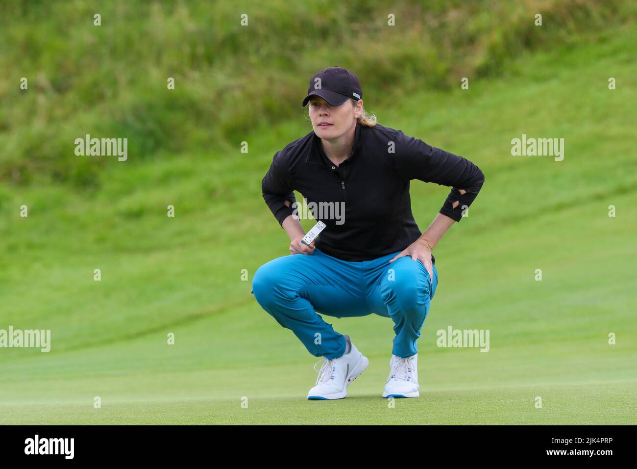 Irvine, UK. 30th July, 2022. The third round of the Trust Golf Women's Scottish Golf took place with 75 players making the cut. Heavy overnight rain from Friday into Saturday made for a softer and more testing course. Maude Aimee Leblanc checking the putting line at the 4th. Credit: Findlay/Alamy Live News Stock Photo