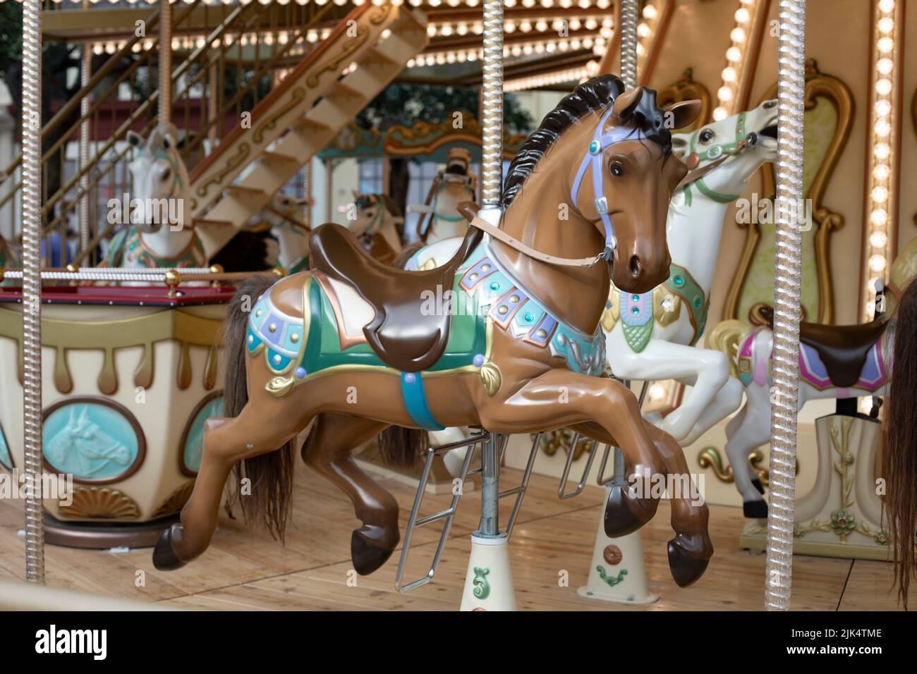 Brown horse in the carousel, flare park family vacation, toy horse for play Stock Photo