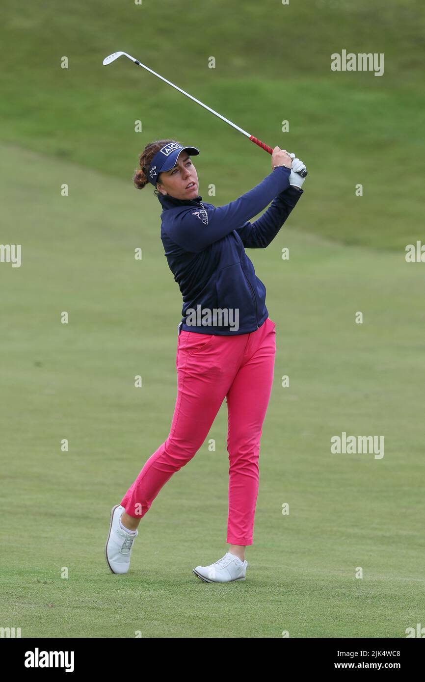 Irvine, UK. 30th July, 2022. The third round of the Trust Golf Women's Scottish Golf took place with 75 players making the cut. Heavy overnight rain from Friday into Saturday made for a softer and more testing course. Georgia Hall playng an iron shot to the green. Credit: Findlay/Alamy Live News Stock Photo