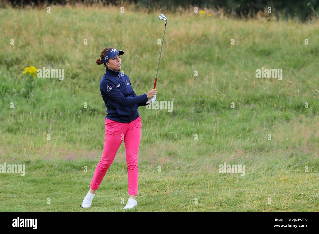 Irvine, UK. 30th July, 2022. The third round of the Trust Golf Women's Scottish Golf took place with 75 players making the cut. Heavy overnight rain from Friday into Saturday made for a softer and more testing course. Georgia Hall playing her second shot to the green on the 2nd fairway. Credit: Findlay/Alamy Live News Stock Photo