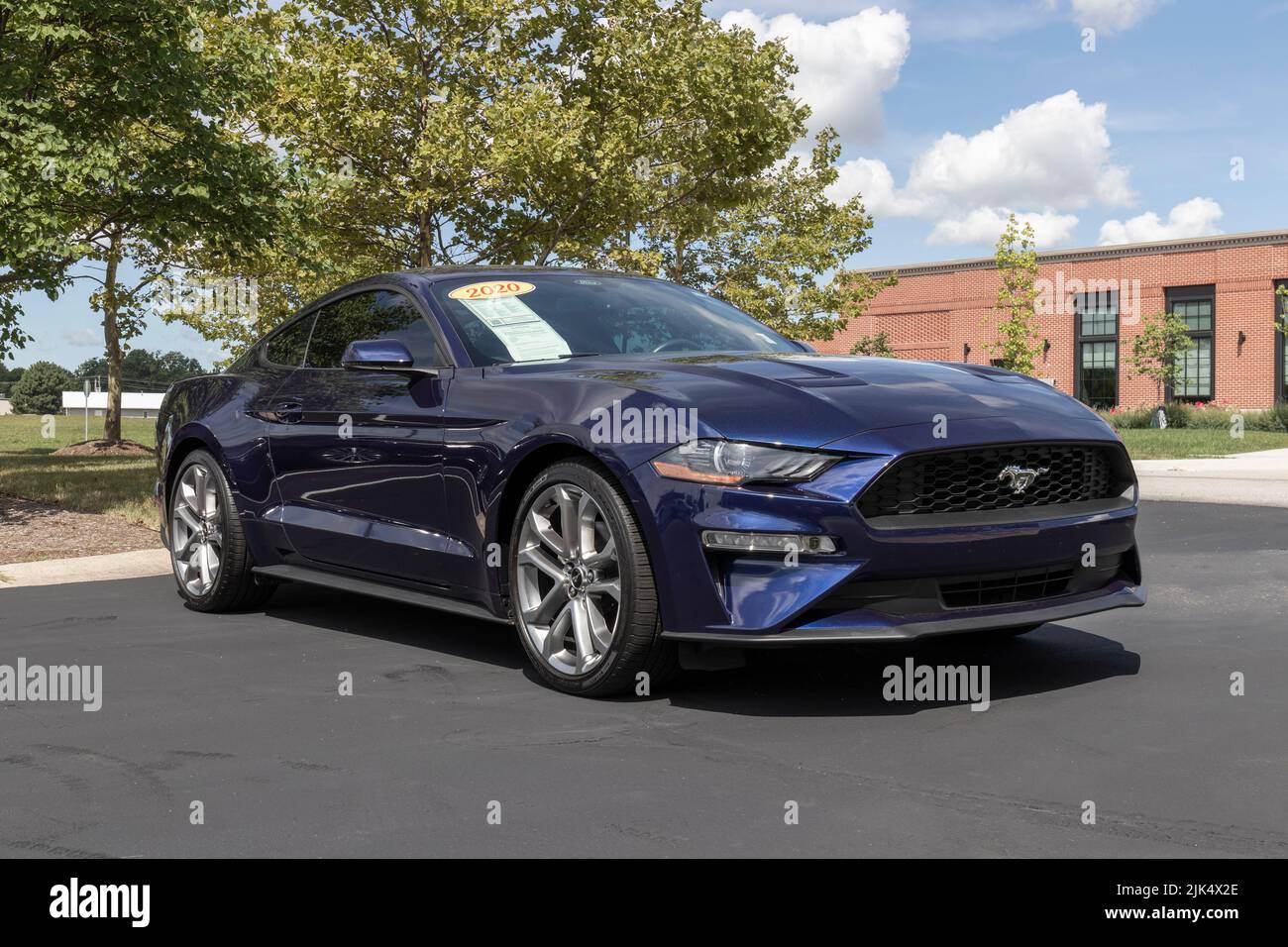 Zionsville - Circa July 2022: Used Ford Mustang display at a dealership. With supply issues, Ford is buying and selling many pre-owned cars to meet de Stock Photo