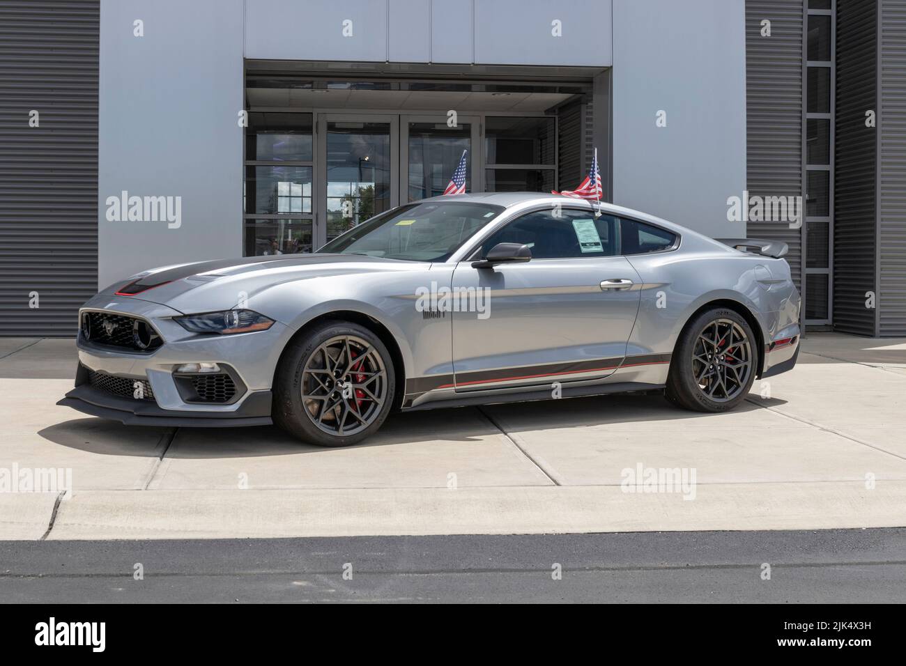 Plainfield - Circa July 2022: Ford Mustang display at a dealership. Mustangs can be ordered in a base model, GT, Mach 1 or Shelby GT500. Stock Photo