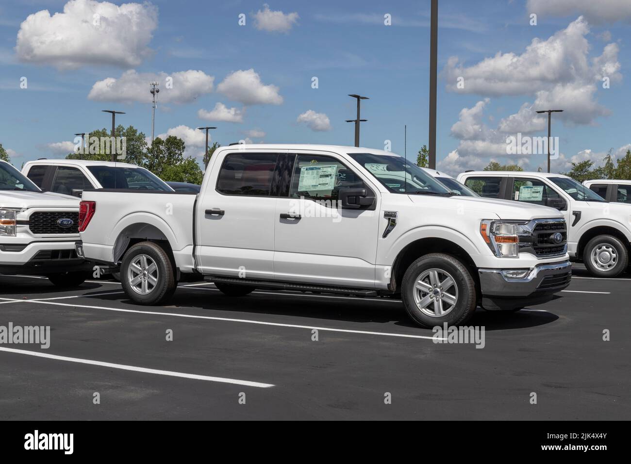 Zionsville - Circa July 2022: Ford F-150 display at a dealership. The Ford F150 is available in XL, XLT, Lariat, King Ranch, Platinum, and Limited mod Stock Photo
