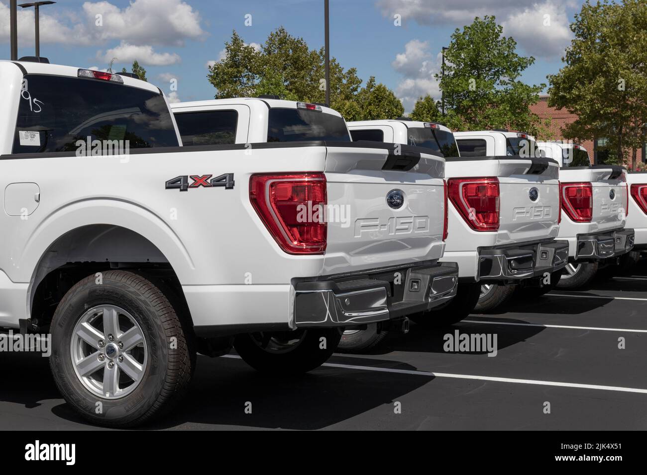 Zionsville - Circa July 2022: Ford F-150 display at a dealership. The Ford F150 is available in XL, XLT, Lariat, King Ranch, Platinum, and Limited mod Stock Photo