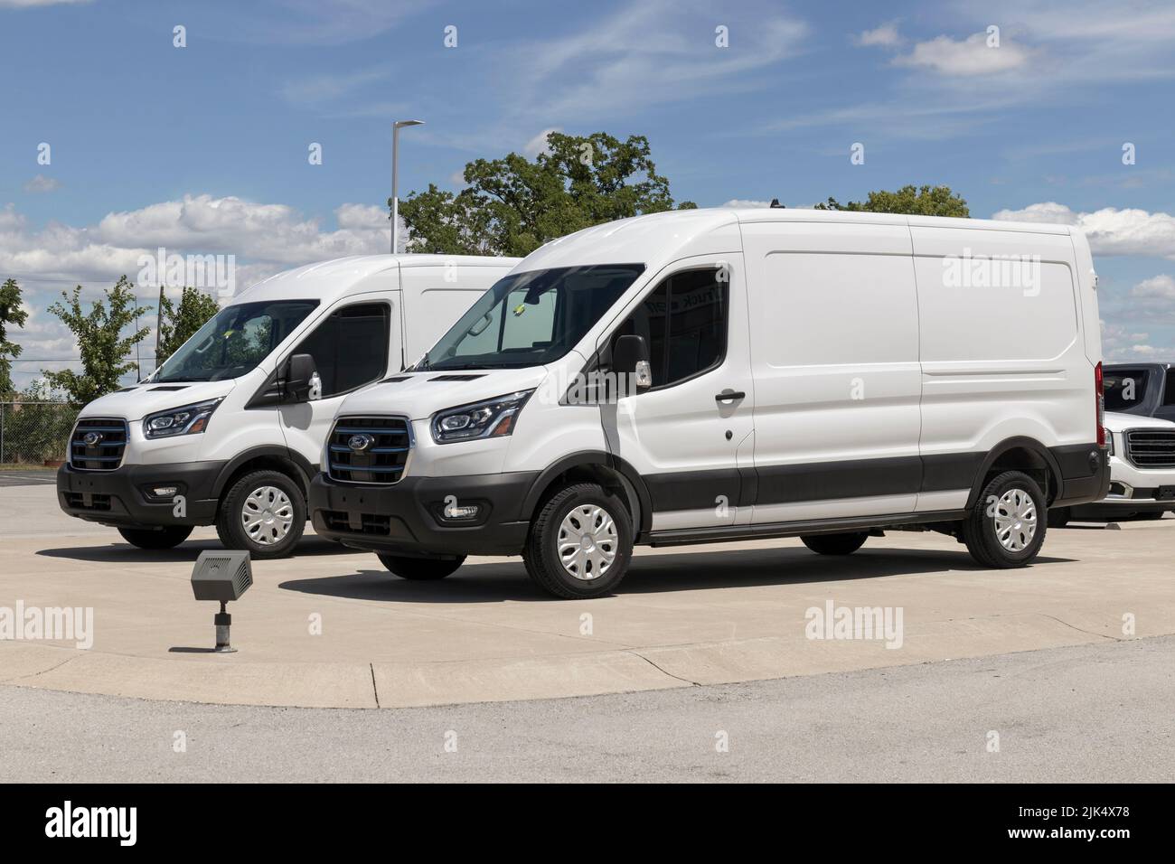 Indianapolis - Circa July 2022: Ford Transit display at a dealership. Ford offers the Transit in Cargo, Crew and Passenger models. Stock Photo