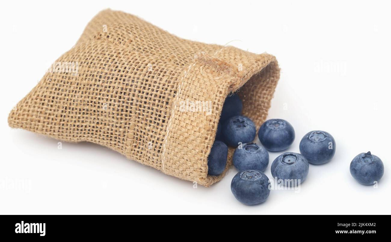 Fresh blueberries in a jute sack over white background Stock Photo