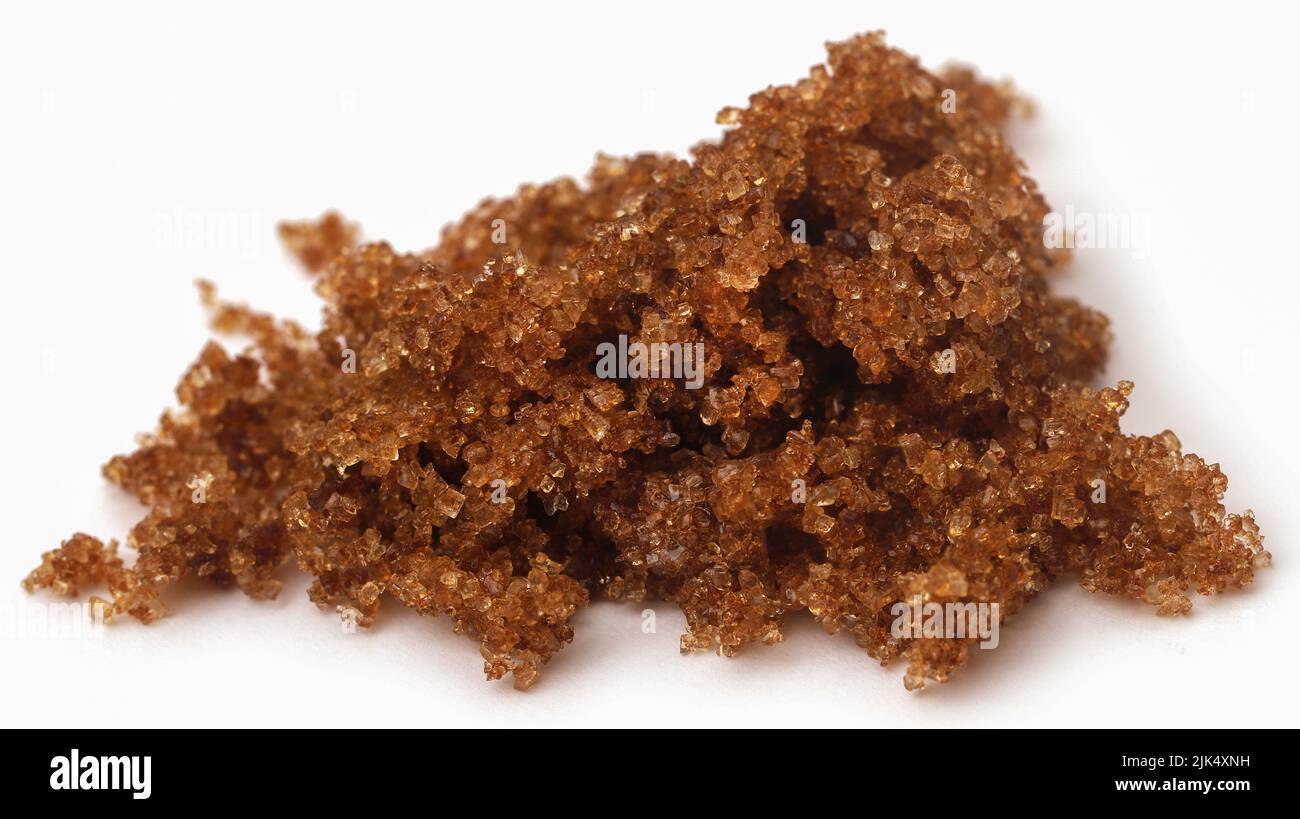 Brown sugar closeup over white background Stock Photo