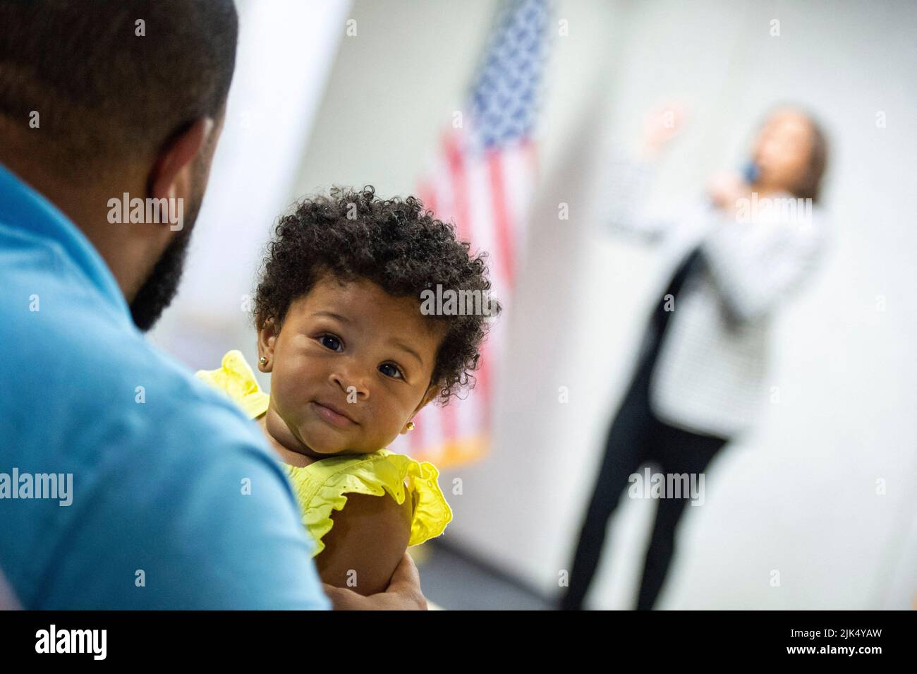 A baby looks on as U.S. Vice President Kamala Harris speaks with Democratic National Committee staff and volunteers to commemorate 100 days from the midterms on Saturday, July 30, 2022 in Washington, DC. (Photo by Bonnie Cash/Pool/ABACAPRESS.COM) Stock Photo