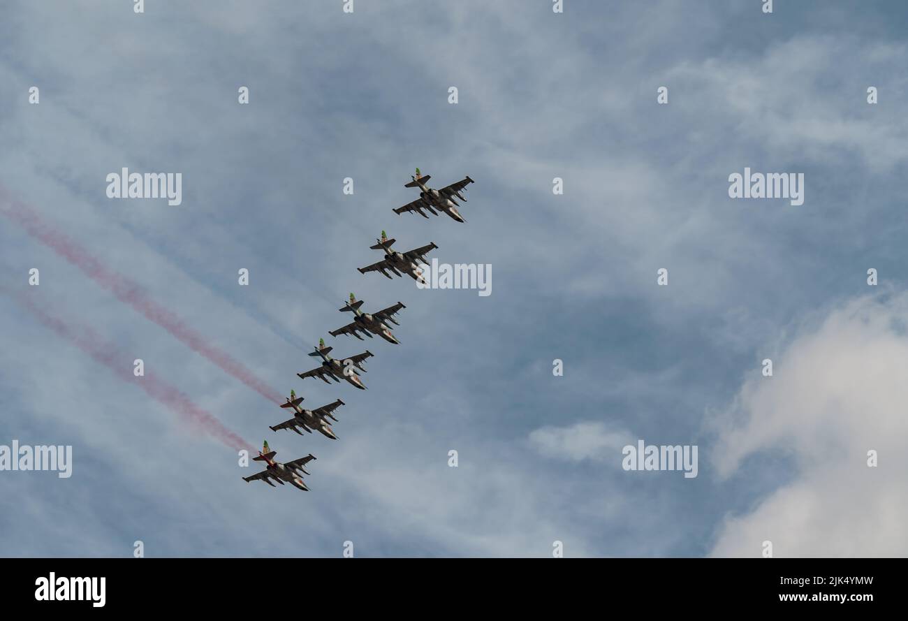 Russian Air Force planes paint the colors of the Russian flag in the sky on St. Petersburg during the celebration of the Day of the Navy Stock Photo
