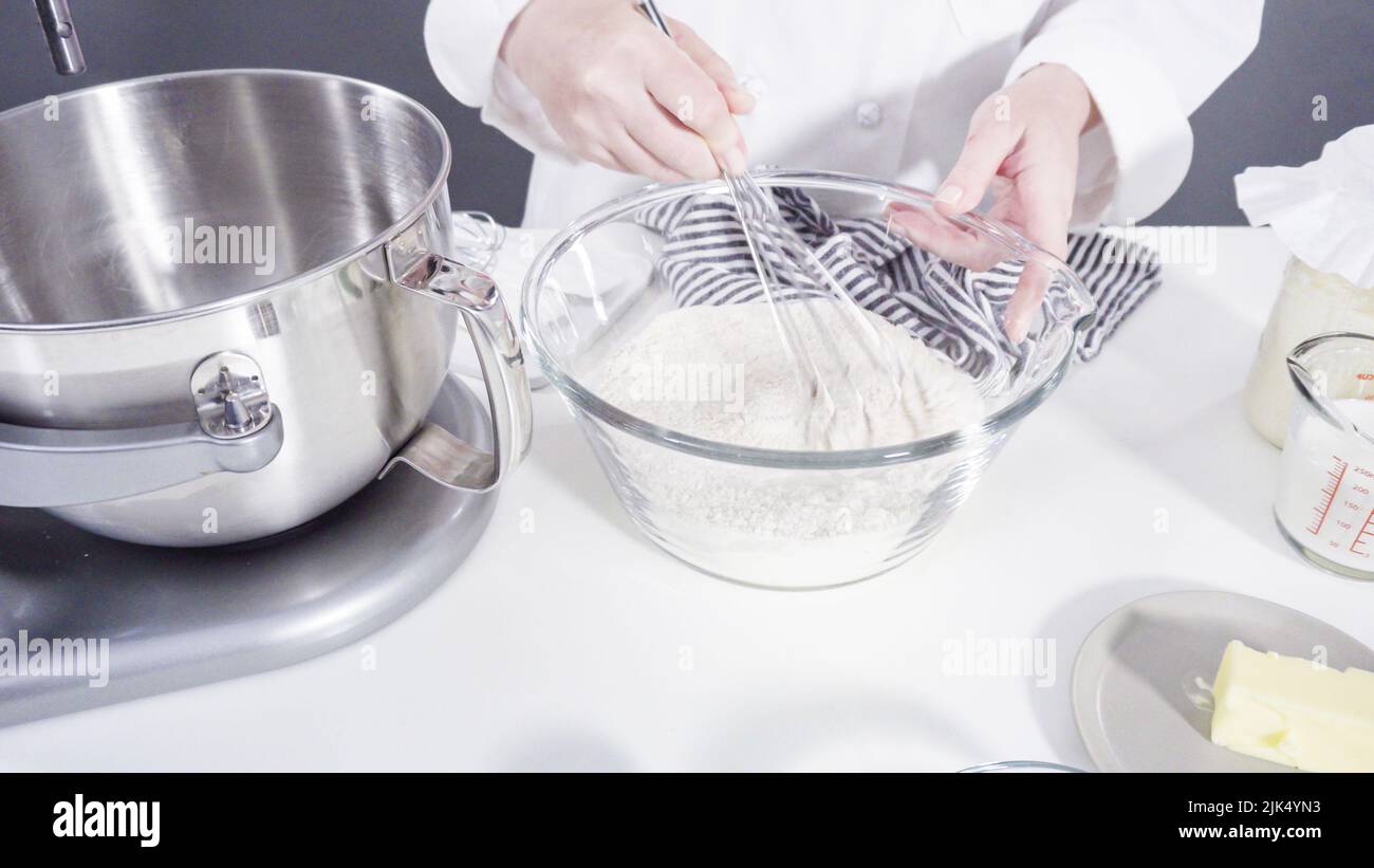 Mixing ingredients in a kitchen standing mixer to bake cinnamon rolls Stock Photo Alamy