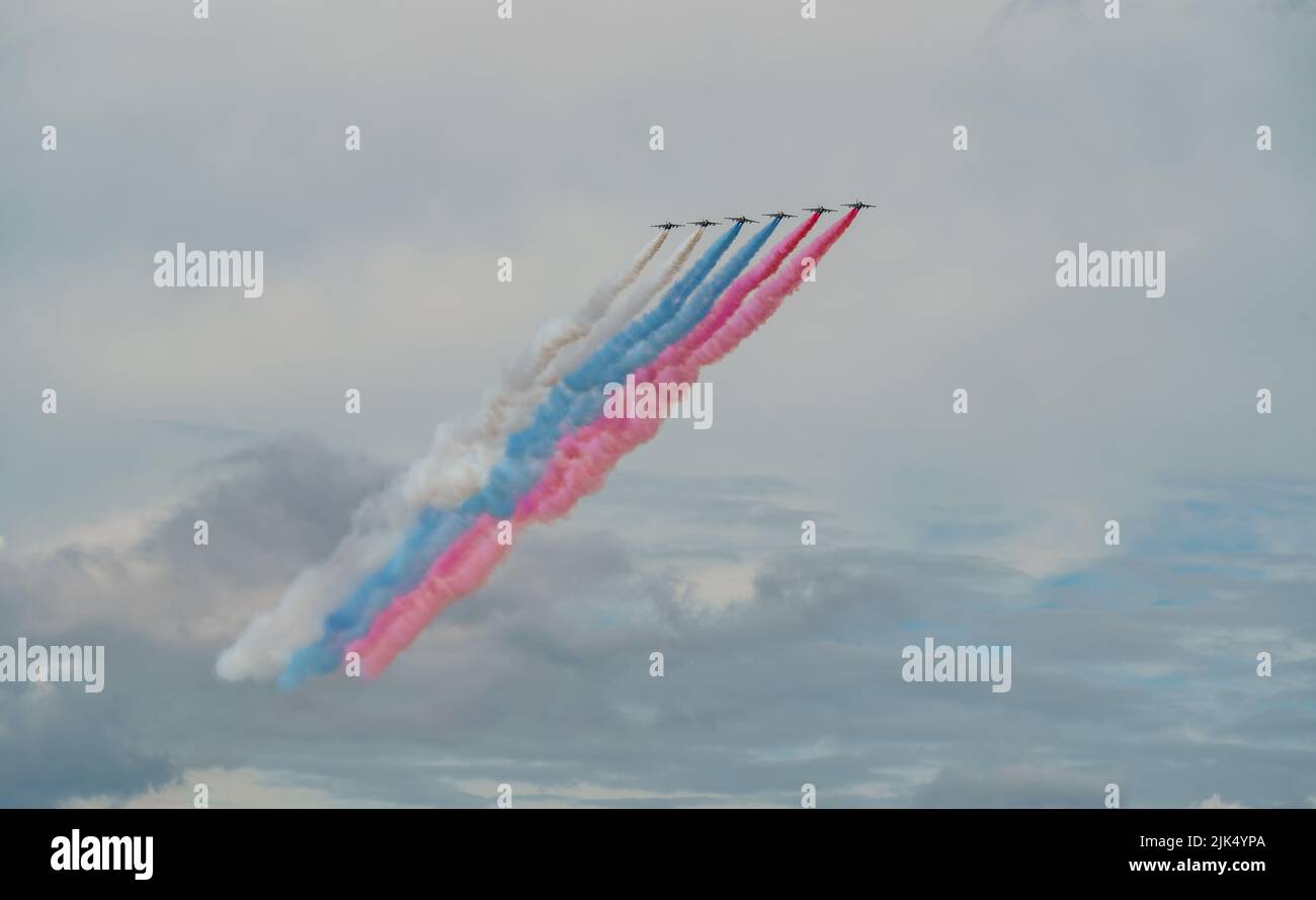 Russian Air Force planes paint the colors of the Russian flag in the sky on St. Petersburg during the celebration of the Day of the Navy Stock Photo