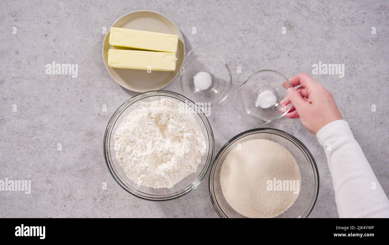 Flat lay. Ingredients in a glass mixing bowls to bake a lemon pound