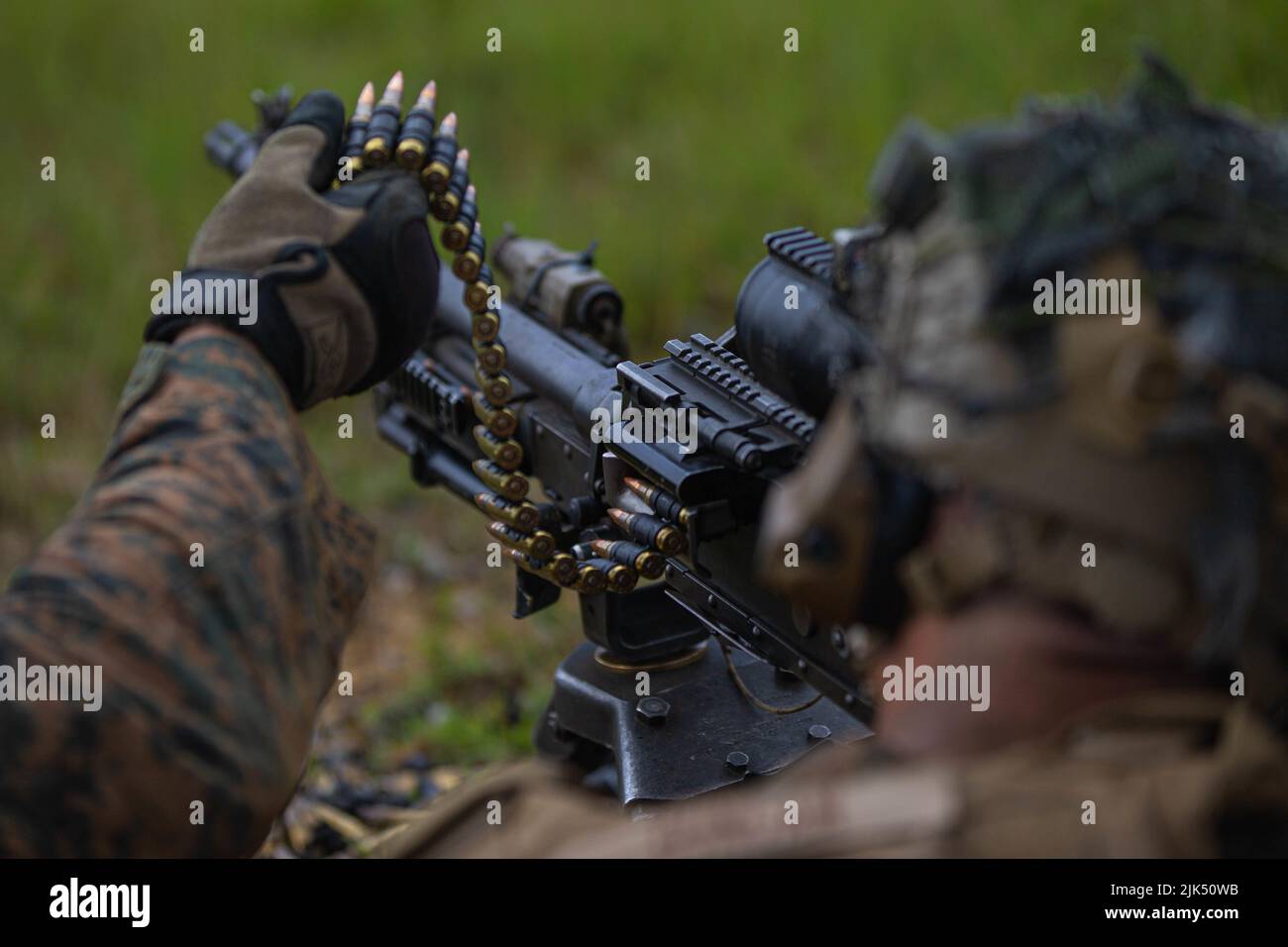 U.S. Marine Corps Lance Cpl. Hyatt Duncan, a machine gunner with 3d  Battalion, 2d Marines, fires an M240B medium machine gun while conducting  squad attack drills during a Tactical Small Unit Leader