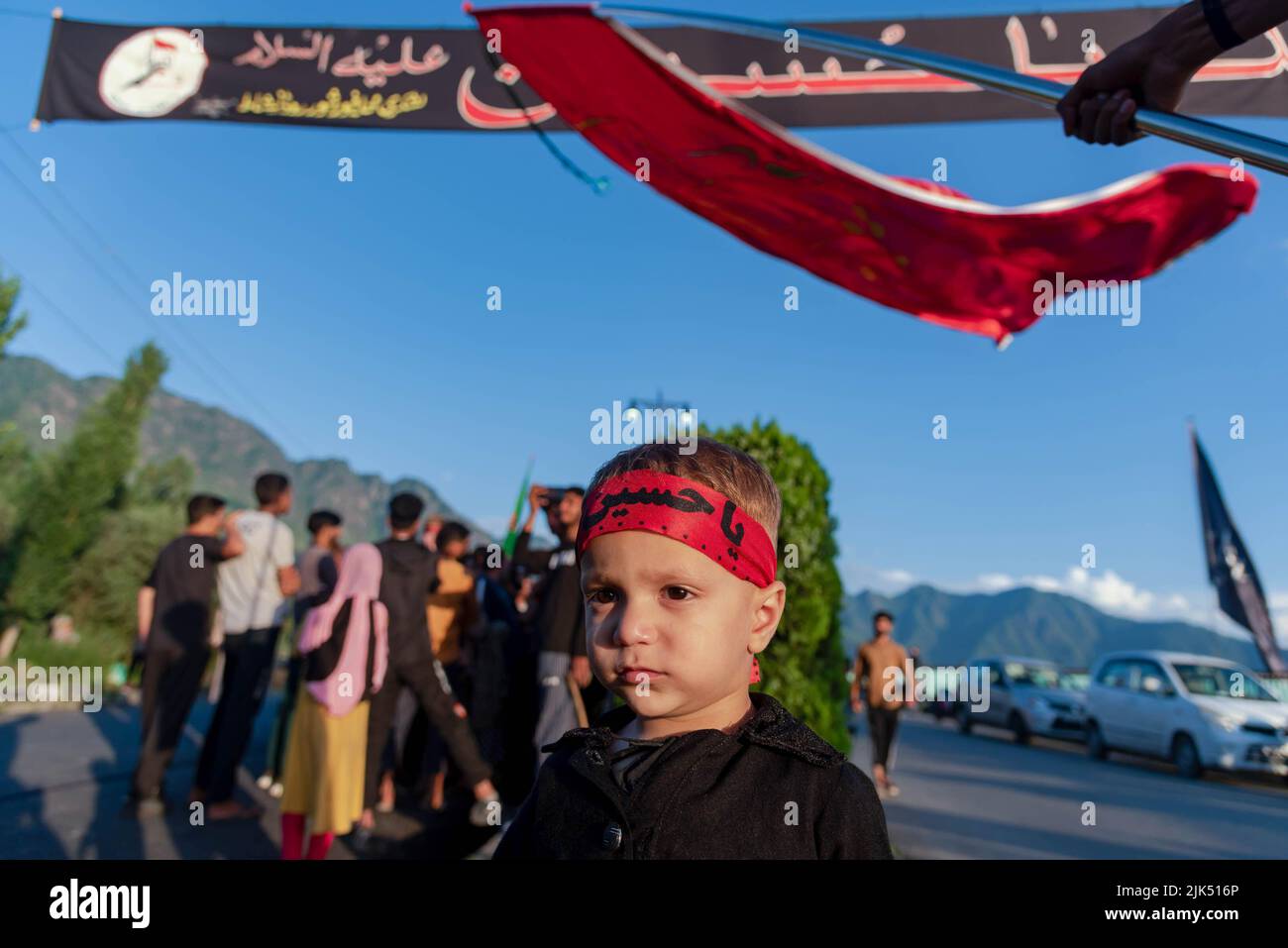 Srinagar, India. 30th July, 2022. A Kashmiri Shia Muslim boy wearing a ...