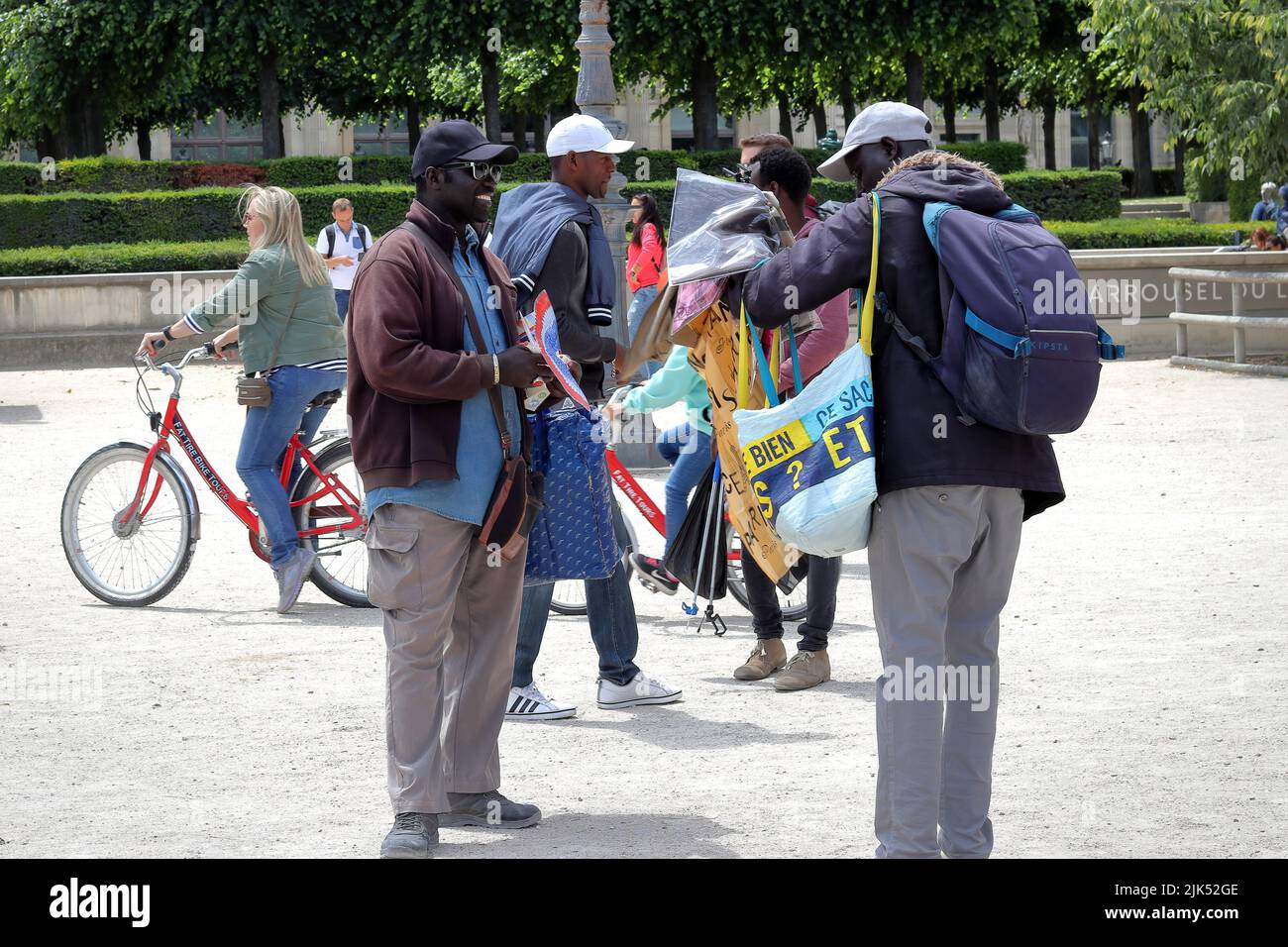 Paris / France - June 10 2019: street vendors selling souvenirs to tourists near the Arc de Triomphe du Carrousel in Tuileries garden in Paris, France Stock Photo