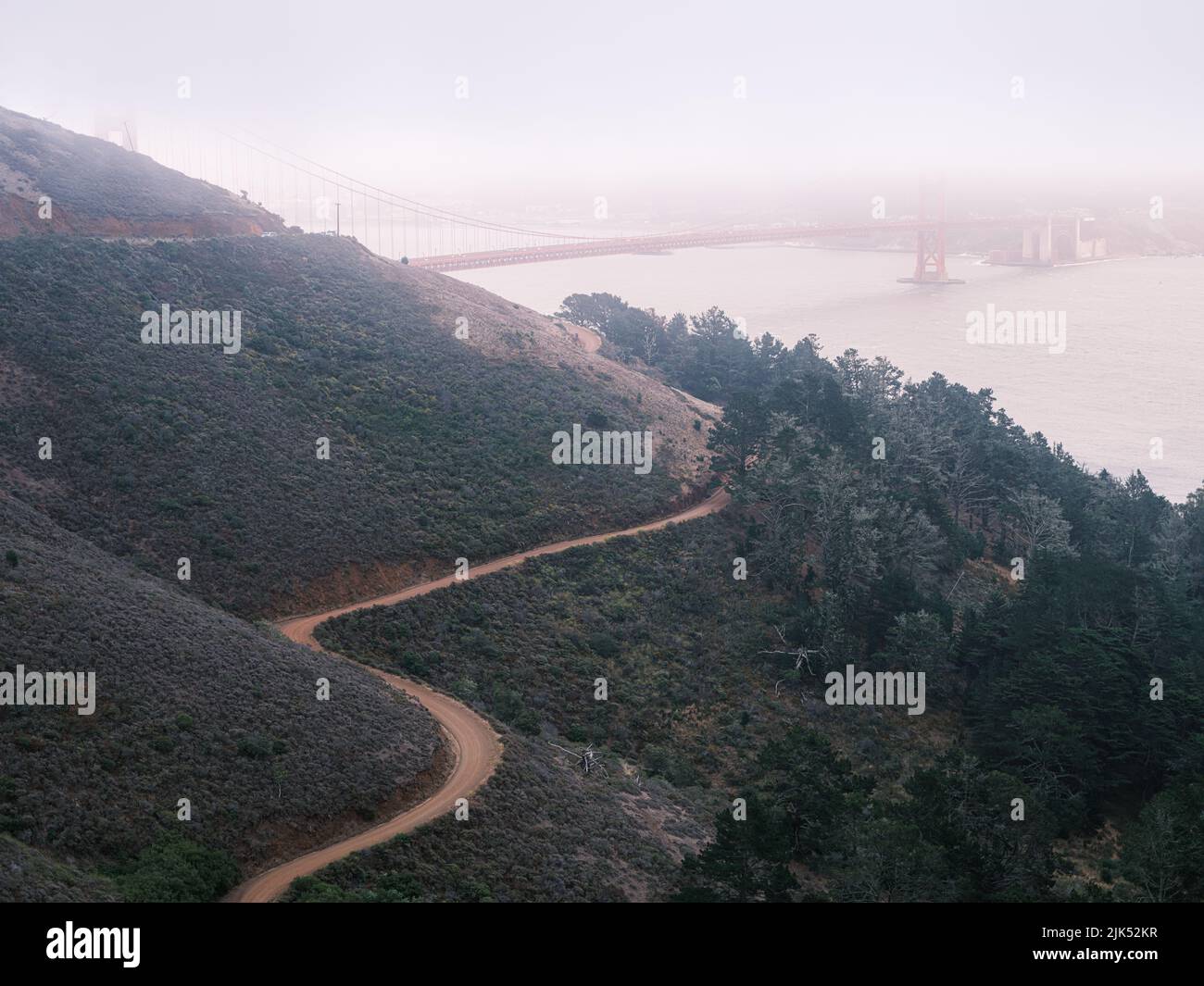 View from the top of the hill, Golden Gate Bridge on a foggy July afternoon. Stock Photo