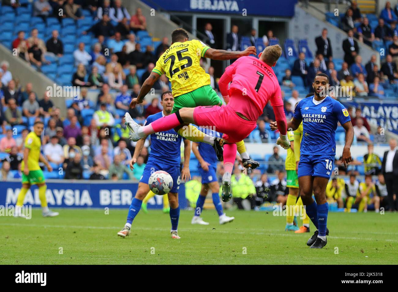 Cardiff, UK. 30th July, 2022. Onel Hernandez of Norwich city (25) collides with Ryan Allsop, the goalkeeper of Cardiff City. EFL Skybet championship match, Cardiff city v Norwich City at the Cardiff City Stadium in Cardiff, Wales on Saturday 30th July 2022. this image may only be used for Editorial purposes. Editorial use only, license required for commercial use. No use in betting, games or a single club/league/player publications. pic by Andrew Orchard/Andrew Orchard sports photography/Alamy Live news Credit: Andrew Orchard sports photography/Alamy Live News Stock Photo