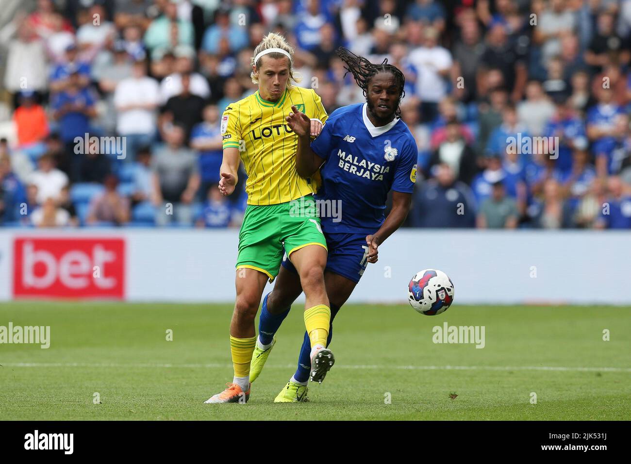 Cardiff, UK. 30th July, 2022. Todd Cantwell of Norwich City (l) & Romaine Sawyers of Cardiff City (r) in action. EFL Skybet championship match, Cardiff city v Norwich City at the Cardiff City Stadium in Cardiff, Wales on Saturday 30th July 2022. this image may only be used for Editorial purposes. Editorial use only, license required for commercial use. No use in betting, games or a single club/league/player publications. pic by Andrew Orchard/Andrew Orchard sports photography/Alamy Live news Credit: Andrew Orchard sports photography/Alamy Live News Stock Photo