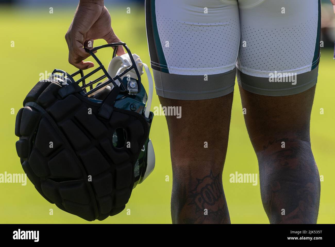 Philadelphia, PA, USA. 30th July, 2022. Philadelphia Eagles Linebacker HAASON  REDDICK (7) carries his helmet with padded shell called a Guardian Cap  during training camp activities on Saturday, July 30, 2022, at